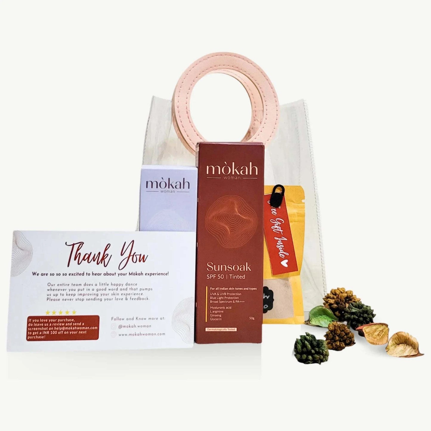 Mòkah Skin Love Duo with skincare items in a chic, travel-friendly pouch and hot chocolate sachet.