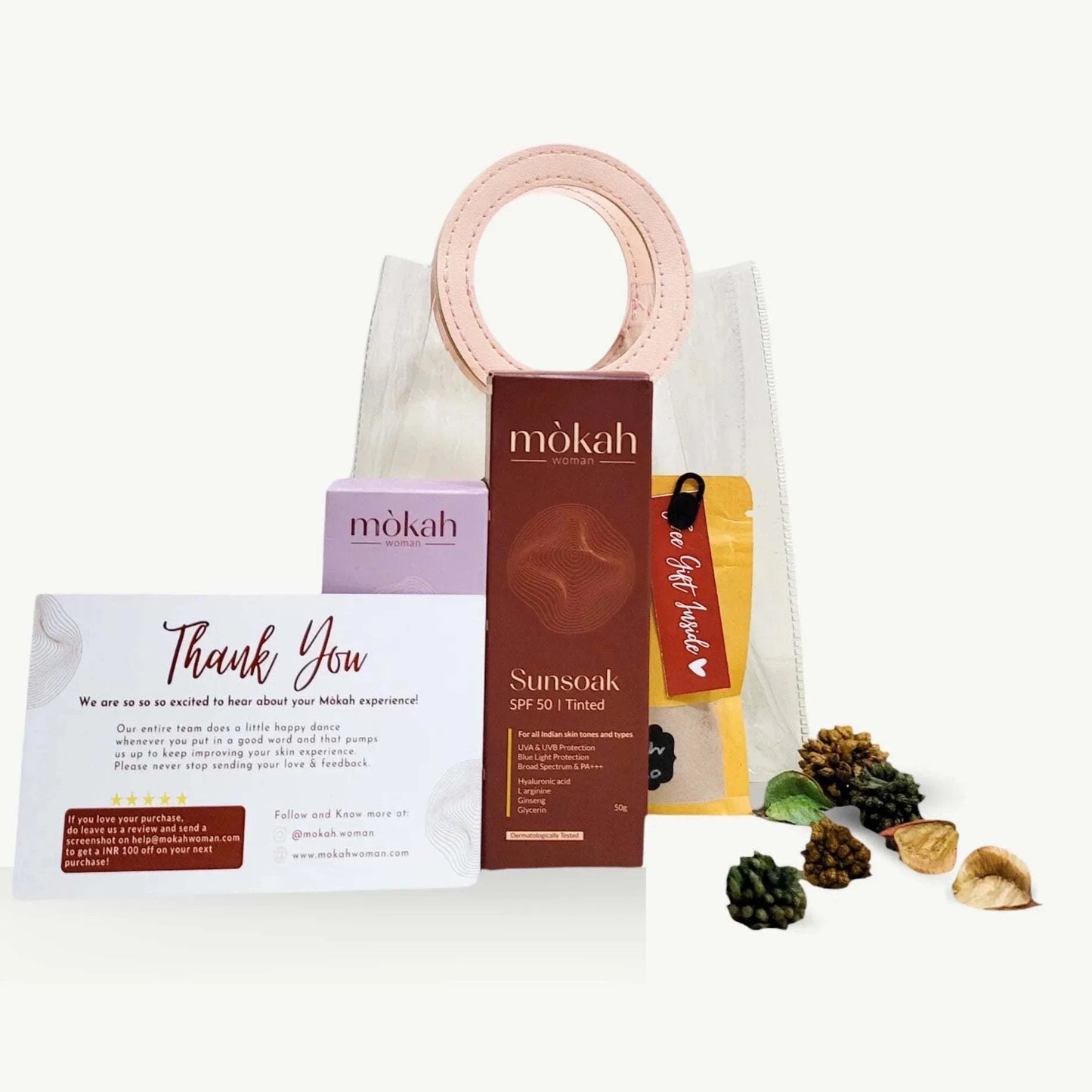 Mòkah Bestseller Duo with Sunsoak SPF 50, Mellow Serum, travel pouch, and hot chocolate.