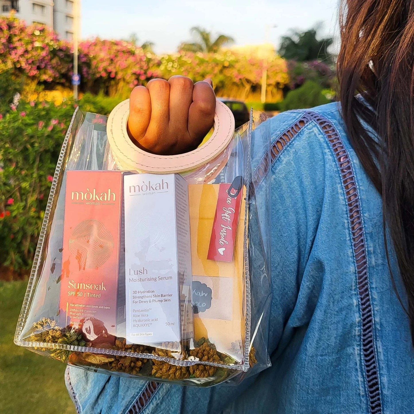 Mòkah Skin Love Duo with Sunsoak SPF 50, Lush Moisturising Serum, and GlowUp Bag in a chic, travel-friendly pouch.