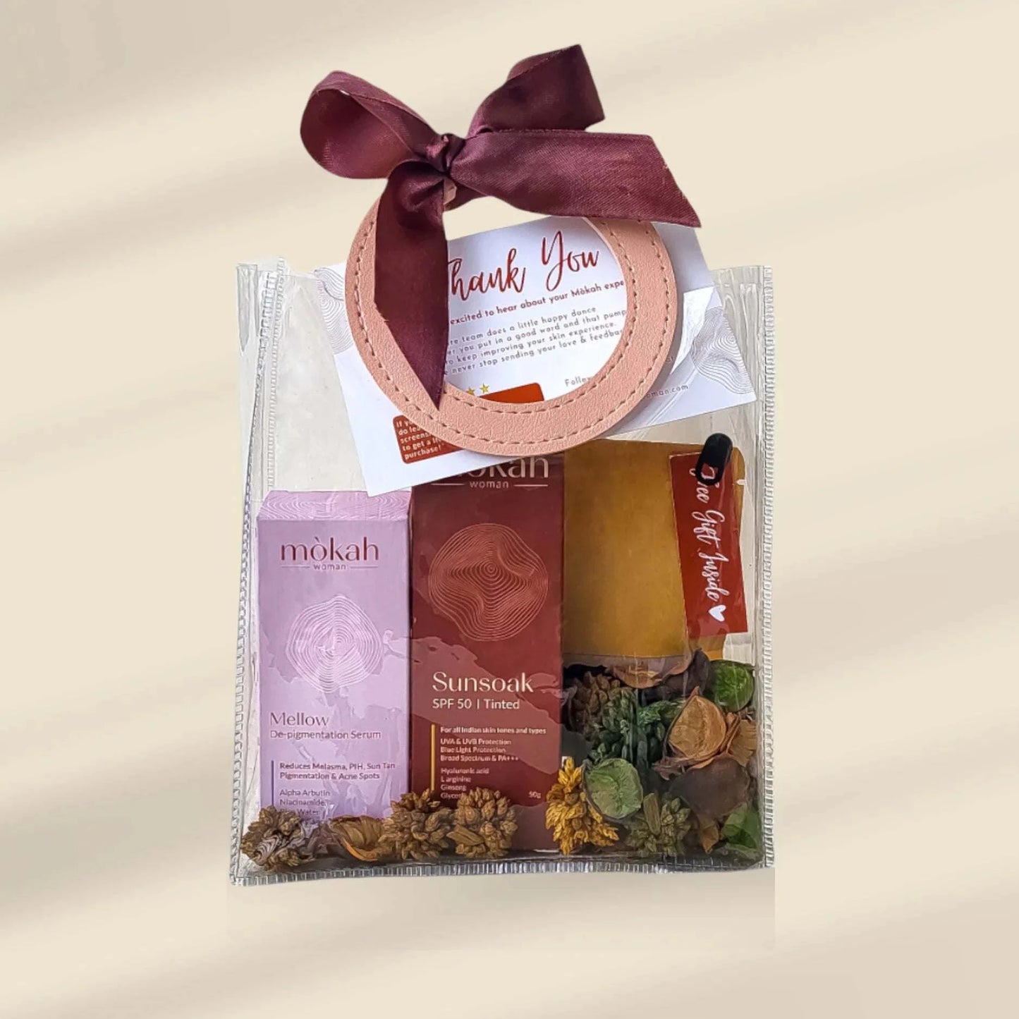 Mòkah Bestseller Duo with skincare products, travel pouch, and hot chocolate in a styled gift package.